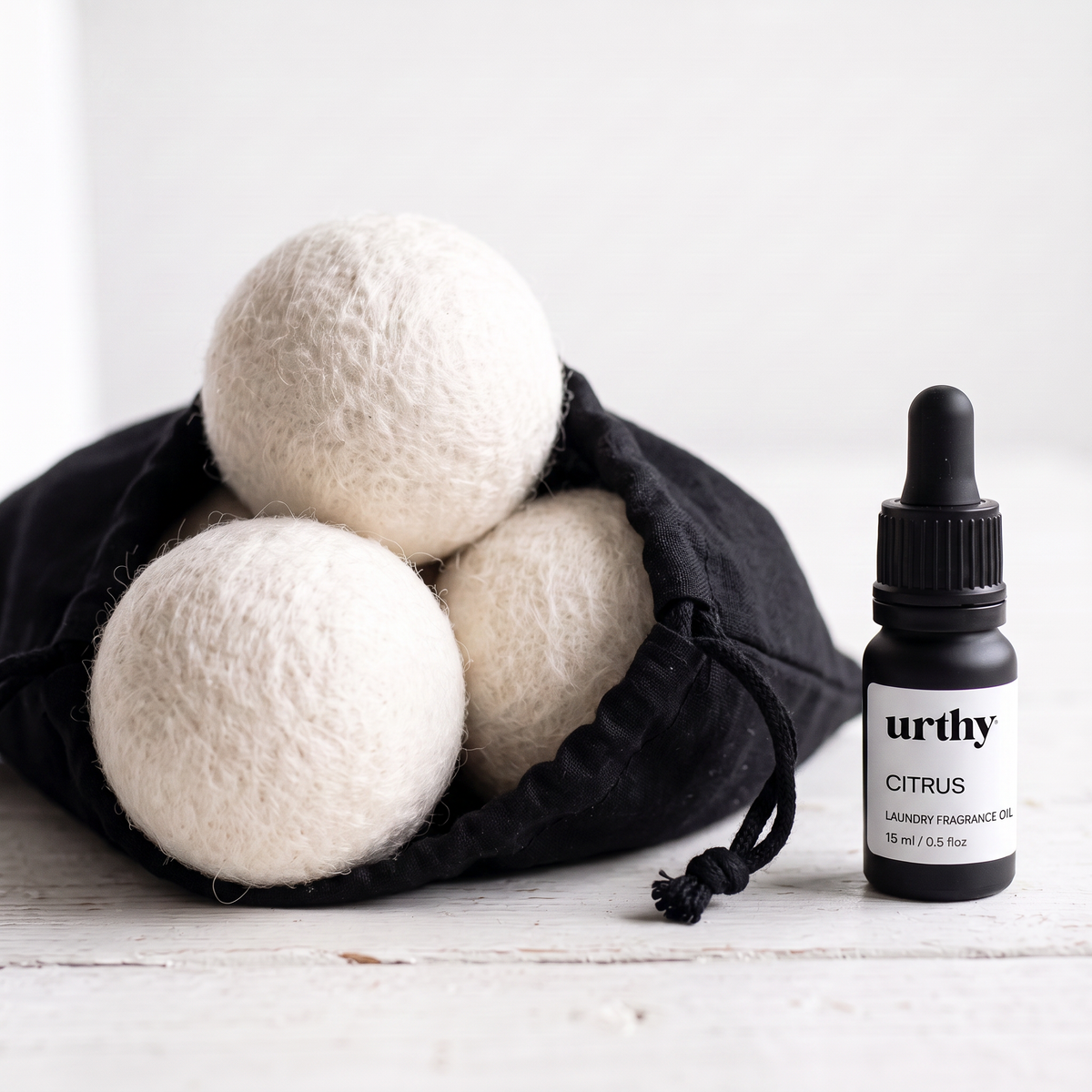 Scent Your Laundry Kit — wool dryer balls in cloth drawstring bag with Urthy laundry fragrance oil