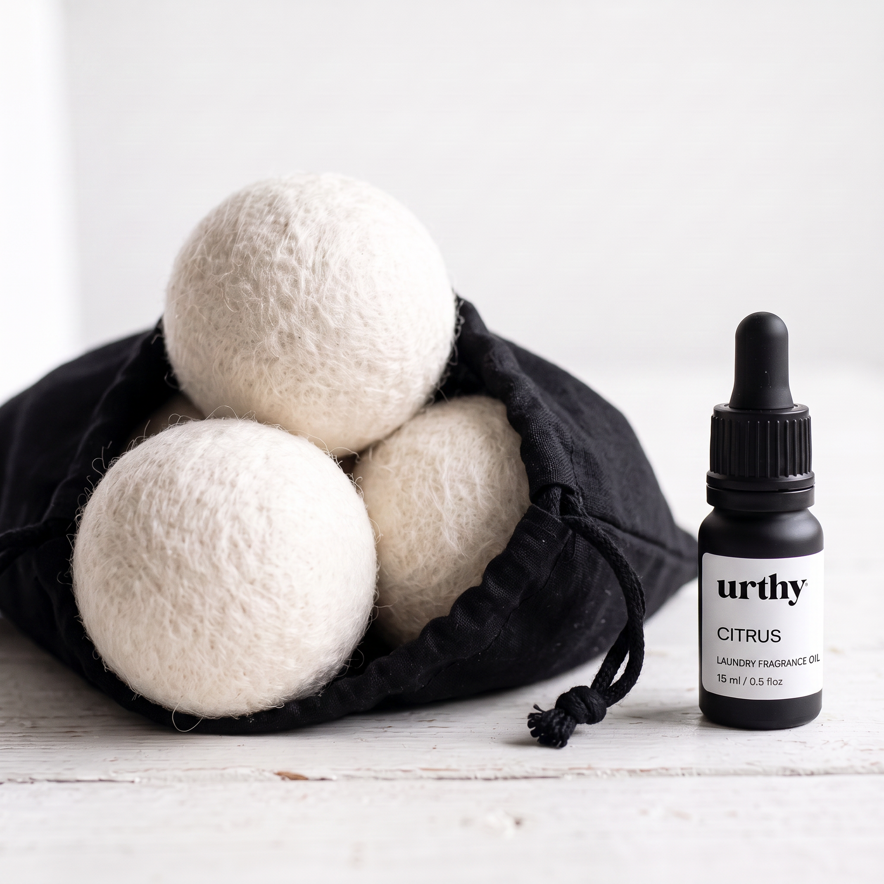 Scent Your Laundry Kit — wool dryer balls in cloth drawstring bag with Urthy laundry fragrance oil