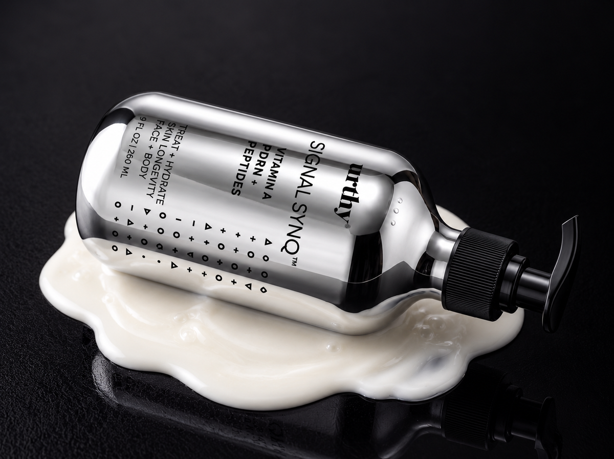 Signal Synq 9 fl oz bottle lying in a pool of white lotion